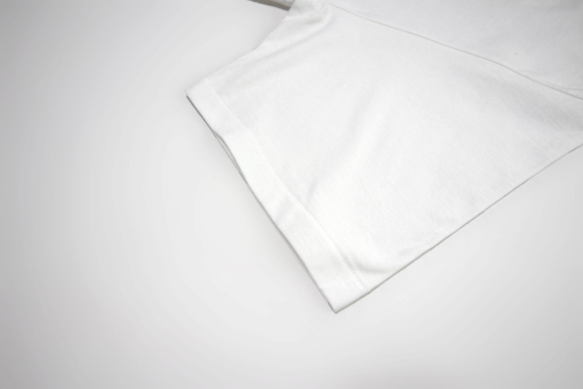 White JA-101 single-stitch sleeve and hem detail